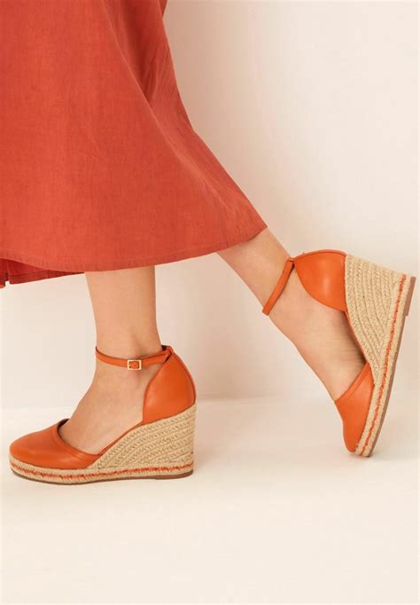 orange closed toe sandals.